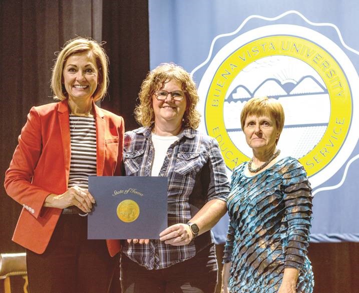 Pictured left to right: Governor Kim Reynolds, LeAnn Ol